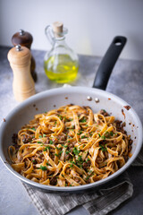 fettuccine ragu in frying pan