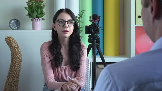 Female Reporter. Amateur Journalist Interviewing A Man. A Cheerful  Young Woman Talking And Smiling. Recording  Documentary Interview