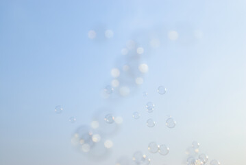 de-focused.Soap bubbles on gray white background,for advertisement,texture,design,cosmetics,free space for text,texture background concept.