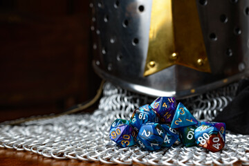 Role Playing Game and game dice and templar knight armour in the table top game epic play for RPG....