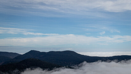 Mount Mansfield Vermont peeking out above the clouds