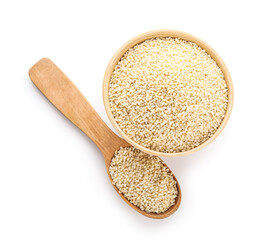Bowl and spoon with sesame seeds on white background