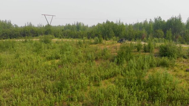 4K Drone Video of the ATV Driving Around Tanana Lake Recreation Area in Fairbanks, AK during Summer Day