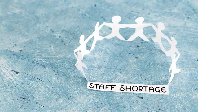 staff shortages and business struggling after the pandemic, peper people chain with text on blue background