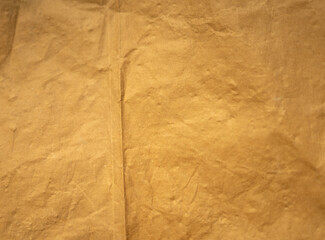 Fototapeta premium golden old paper with torn and crumpled texture for background