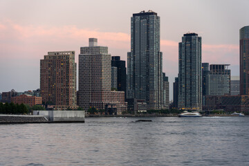 ferry passing in front of long island city skyline