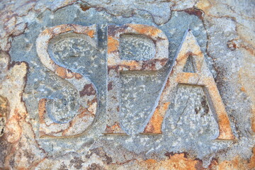 word SPA : stone carving