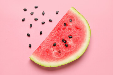 Slice of tasty watermelon with seeds on pink background