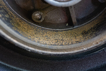 Yellow rust stains on the inside of the motorcycle hub.