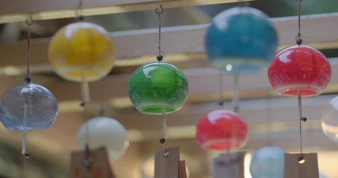 Colorful wind chimes blowing in the wind at the Hikawa shrine in Kawagoe in Japan during summer