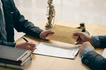 The bribe lawyer took the money in the envelope. A clipped view of a judge accepting a present from...
