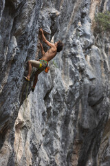 rock climber climbs the rock.