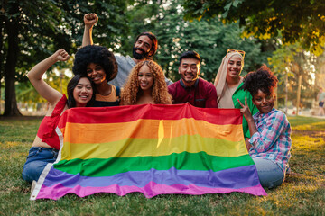 Gay rights activists with pride flag outdoors