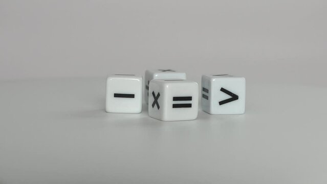 Four white dice with mathematical math symbols. Business concept with miniature.
