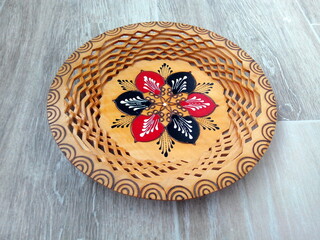 Ornamental wooden plate with traditional Romanian motif