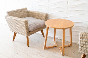 Fototapeta premium empty wicker sofa with table