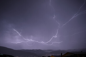 Naklejka na ściany i meble lightning in the night sky, Huge lightning during rainy day in Bursa over grand mountain local name is uludag