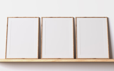 Modern poster frame mockup, minimal room design on white interior background, three wooden frames mock up, 3d render