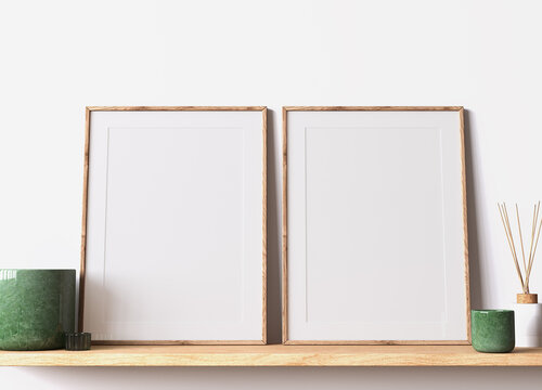 Modern poster frame mockup, minimal room design on white interior background, two wooden frames mock up, 3d render