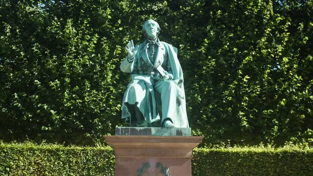 Hans Christian Andersen a.k.a H. C. Andersen, statue in slowmotion at Kongens Have Copenhagen, Denmark