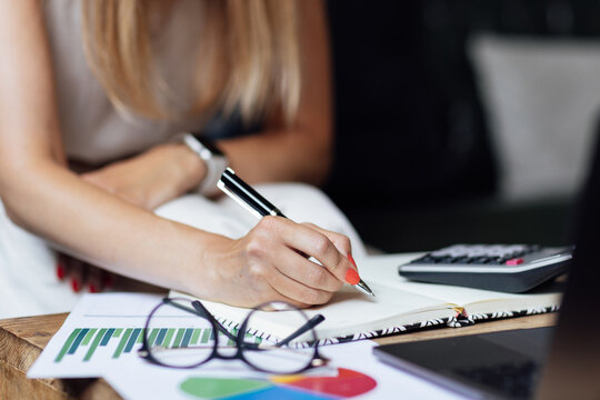 Auditor accountant or financial expert ceo manager looking marketing research report, analyzing graph data and finance chart and developing growth strategy, working on computer alone at modern