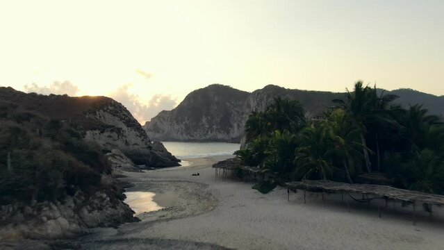 Drone Flying Over Beautiful Sandy Beach Of Maruata In Michoacan, Mexico At Dusk. low aerial
