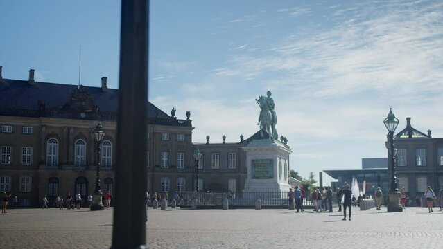 Statue and people at the Amalienborg Square