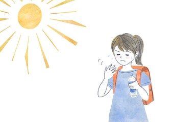 水分補給をする小学生の女の子
