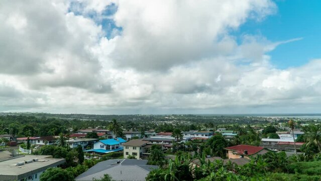 Clouds rolling over residential suburban area of Suva, capital of Fiji, timelapse
