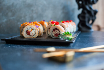 Sushi roll on black board