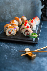 Sushi roll on black board