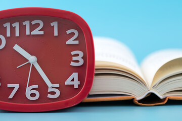 Alarm clock and an open book