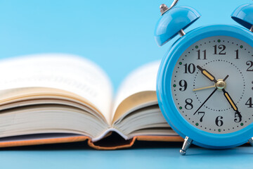 Alarm clock and an open book