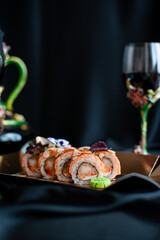 sushi rolls and glasses with wine romantic evening
