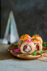 sushi roll on a metal plate