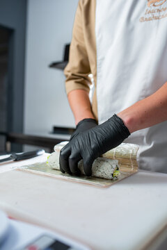 rolls in cheff hand