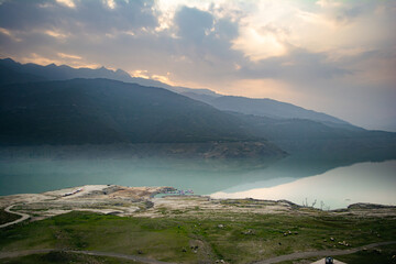 Tehri lake surrounded by mountains in Uttarakhand, india, Tehri Lake is an artificial dam reservoir. Tehri Dam, the tallest dam in India and Tehri dam is Asia's largest man-made lake.