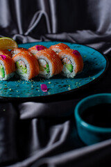 sushi rolls on the blue plate