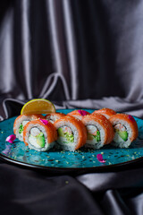 sushi rolls on the blue plate