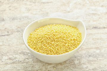 Raw couscous in the bowl