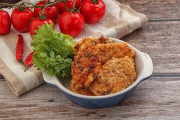 Fried salmonn cutlet in the bowl