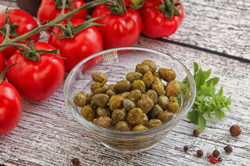 Marinated green capers in the bowl