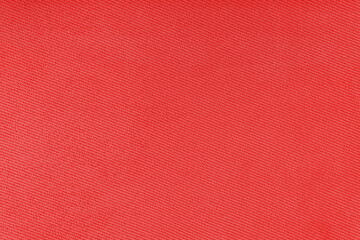 Fototapeta premium Texture of natural red fabric or cloth. Fabric texture diagonal weave of natural cotton or linen textile material. Blue canvas background. Decorative fabric for curtain, furniture, walls, clothes