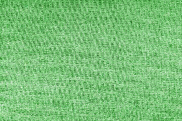 Texture of natural green upholstery fabric or cloth. Fabric texture of natural cotton or linen...