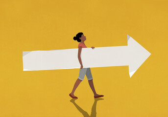 Woman carrying paper arrow on yellow background
