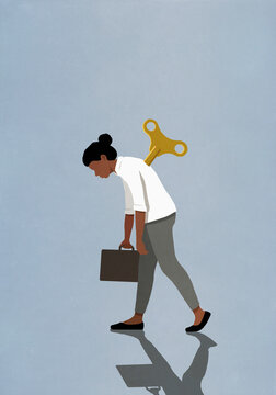 Tired, slumped windup businesswoman walking with briefcase
