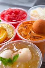 A closeup view of several varieties of milk tea and fruit tea beverages.