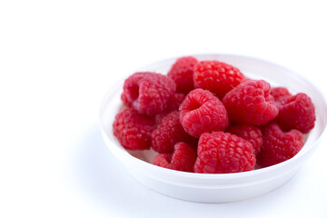 Fototapeta na wymiar A view of a bowl of raspberries.