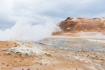 Namafjall, geothermal area in Hverir Hverarönd with tourists strolling. Boiling mud pools and hot springs. Tourist and natural attractions in Iceland Iceland, Europe