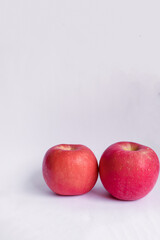 Two Red Fuji Apples on a White Isolated Background
